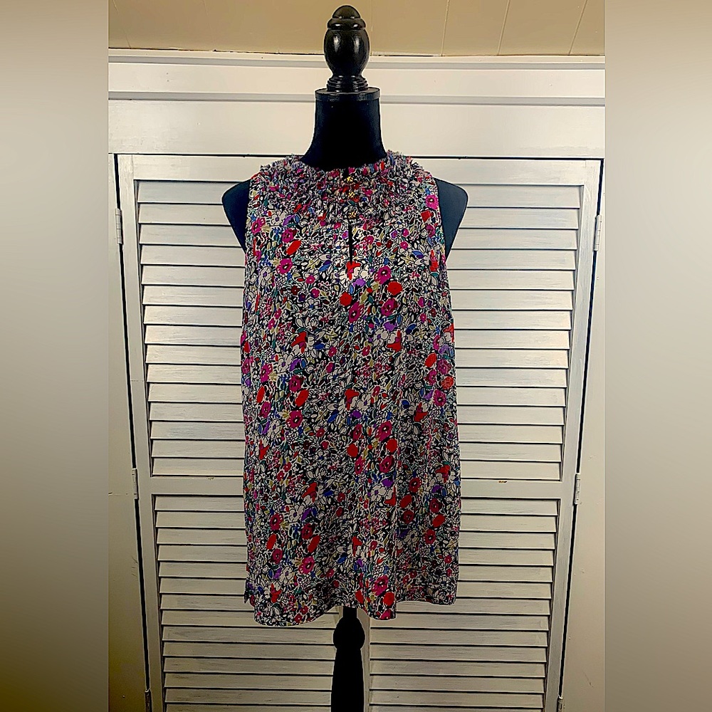 CAbi sleeveless floral top, ruffled neckline gold buttons, like new condition.